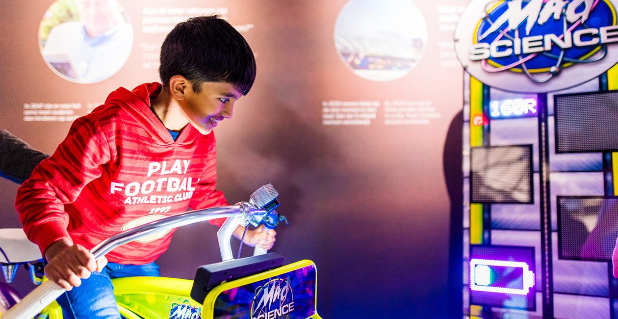 Boy on a mad science ride having fun